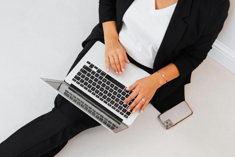 Woman sitting on the floor with laptop